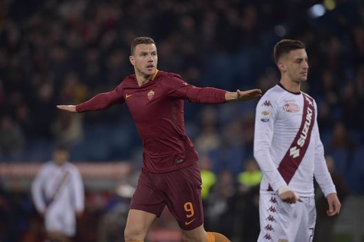ROME, ITALY - FEBRUARY 19: Edin Dzeko of AS Roma celebrates after scoring a goal during the Serie A match between AS Roma and FC Torino at Stadio Olimpico on February 19, 2017 in Rome, Italy. (Photo by Luciano Rossi/AS Roma via Getty Images) ROME, ITALY - FEBRUARY 19: Edin Dzeko of AS Roma celebrates after scoring a goal during the Serie A match between AS Roma and FC Torino at Stadio Olimpico on February 19, 2017 in Rome, Italy. (Photo by Luciano Rossi/AS Roma via Getty Images)