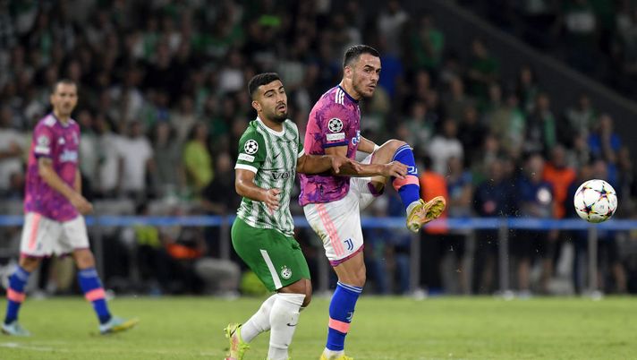 HAIFA, ISRAEL - OCTOBER 11: Filip Kostic of Juventus battles for the ball with Mohammed Abu Fani of Maccabi Haifa during the UEFA Champions League group H match between Maccabi Haifa FC and Juventus at Sammy Ofer Stadium on October 11, 2022 in Haifa, Israel. (Photo by Filippo Alfero - Juventus FC/Juventus FC via Getty Images) MACCABI-JUVE 2-0