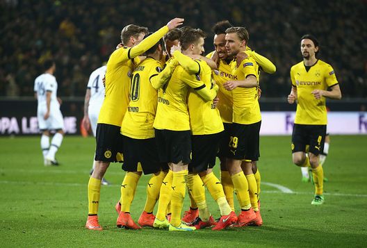 DORTMUND, GERMANY - MARCH 10: Marco Reus of Borussia Dortmund (11) celebrates with team mates as he scores their third goal during the UEFA Europa League Round of 16 first leg match between Borussia Dortmund and Tottenham Hotspur at Signal Iduna Park on March 10, 2016 in Dortmund, Germany. (Photo by Lars Baron/Bongarts/Getty Images) Champions League