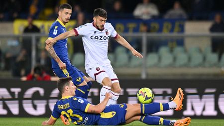 VERONA, ITALY - APRIL 21: Nicola Sansone of Bologna FC is tackled by Giangiacomo Magnani of Hellas Verona during the Serie A match between Hellas Verona and Bologna FC at Stadio Marcantonio Bentegodi on April 21, 2023 in Verona, Italy. (Photo by Alessandro Sabattini/Getty Images)