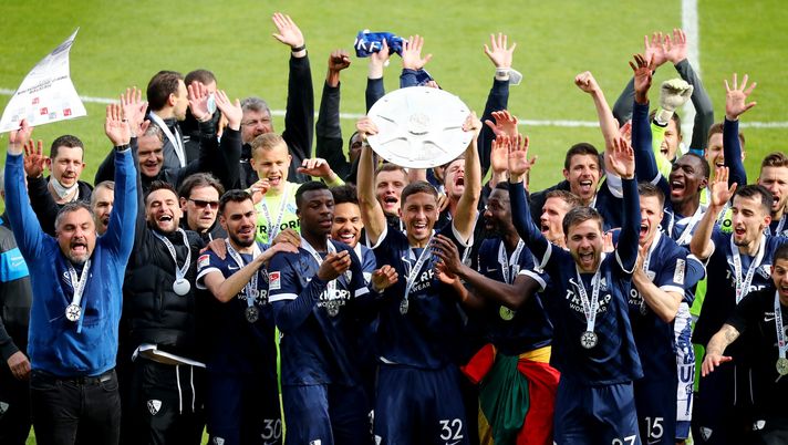 BOCHUM, GERMANY - MAY 23: Robert Zulj of Bochum lifts the Bundesliga 2 Meisterschale after winning after winning the Second Bundesliga match between VfL Bochum 1848 and SV Sandhausen at Vonovia Ruhrstadion on May 23, 2021 in Bochum, Germany. (Photo by Christof Koepsel/Getty Images) 