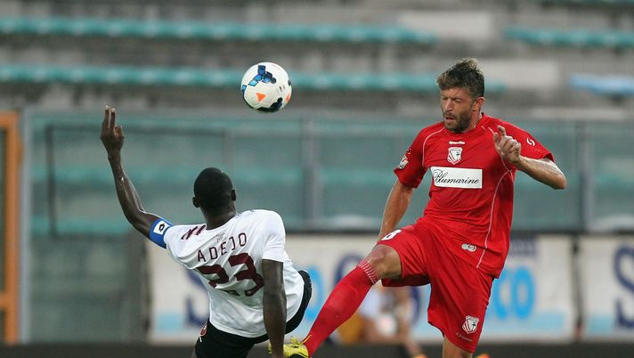REGGIO CALABRIA, ITALY - AUGUST 11:  Daniel Adejo (L) of Reggina competes for the ball with Edgar Cani of Carpi during the Tim Cup match between Reggina Calcio and Carpi F.C. 1909 at Oreste Granillo Stadium on August 11, 2013 at  in Reggio Calabria, Italy.  (Photo by Maurizio Lagana/Getty Images) 