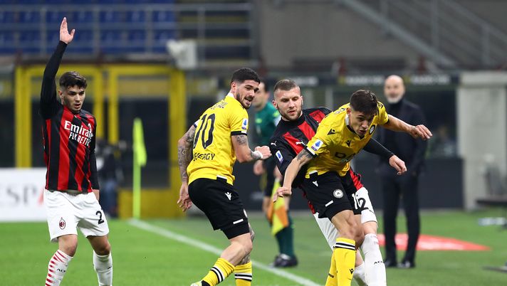 MILAN, ITALY - MARCH 03: Nahuel Molina of Udinese Calcio is challenged by Ante Rebic of A.C. Milan during the Serie A match between AC Milan and Udinese Calcio at Stadio Giuseppe Meazza on March 03, 2021 in Milan, Italy. Sporting stadiums around Italy remain under strict restrictions due to the Coronavirus Pandemic as Government social distancing laws prohibit fans inside venues resulting in games being played behind closed doors. (Photo by Marco Luzzani/Getty Images) MILAN, ITALY - MARCH 03: Nahuel Molina of Udinese Calcio is challenged by Ante Rebic of A.C. Milan during the Serie A match between AC Milan and Udinese Calcio at Stadio Giuseppe Meazza on March 03, 2021 in Milan, Italy. Sporting stadiums around Italy remain under strict restrictions due to the Coronavirus Pandemic as Government social distancing laws prohibit fans inside venues resulting in games being played behind closed doors. (Photo by Marco Luzzani/Getty Images)