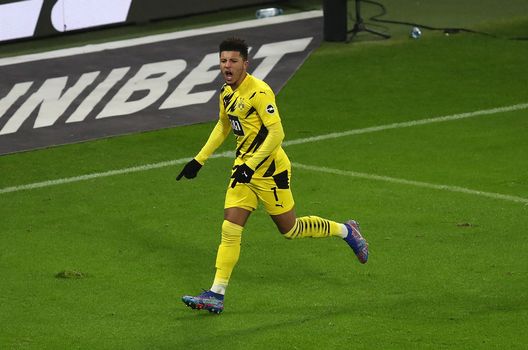 LEIPZIG, GERMANY - JANUARY 09: Jadon Sancho of Borussia Dortmund celebrates after scoring their team's first goal during the Bundesliga match between RB Leipzig and Borussia Dortmund at Red Bull Arena on January 09, 2021 in Leipzig, Germany. Sporting stadiums around Germany remain under strict restrictions due to the Coronavirus Pandemic as Government social distancing laws prohibit fans inside venues resulting in games being played behind closed doors. (Photo by Maja Hitij/Getty Images) LEIPZIG, GERMANY - JANUARY 09: Jadon Sancho of Borussia Dortmund celebrates after scoring their team's first goal during the Bundesliga match between RB Leipzig and Borussia Dortmund at Red Bull Arena on January 09, 2021 in Leipzig, Germany. Sporting stadiums around Germany remain under strict restrictions due to the Coronavirus Pandemic as Government social distancing laws prohibit fans inside venues resulting in games being played behind closed doors. (Photo by Maja Hitij/Getty Images)