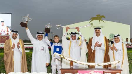 DOHA, QATAR - FEBRUARY 24: Presentation for Easter De Faust and Harry Bentley winning the 1850m H.H.The Emir's Silver Sword race, (Second from left, Trainer Jassim Mohammed Ghazali Jahromi, Jockey Harry Bentley and second from right, HH Sheikh Tamim Bin Hamad Al Thani, Emir of Qatar) at Al Rayyan Racecourse on February 24, 2018 in Doha, Qatar. (Photo by Neville Hopwood/Getty Images)
