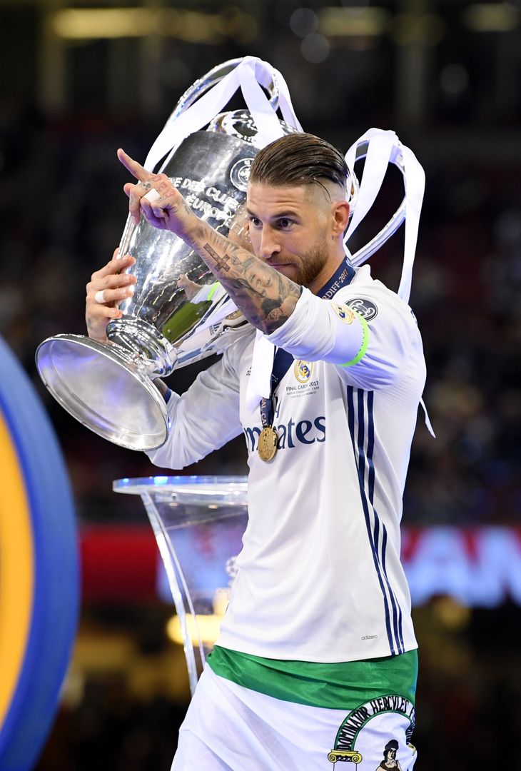  CARDIFF, WALES - JUNE 03: Sergio Ramos of Real Madrid celebrates with The Champions League trophy after the UEFA Champions League Final between Juventus and Real Madrid at National Stadium of Wales on June 3, 2017 in Cardiff, Wales.  (Photo by Matthias Hangst/Getty Images) 