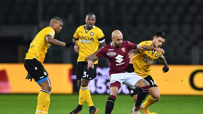TURIN, ITALY - DECEMBER 12: Simone Zaza of Torino F.C. and Kevin Bonifazi of Udinese Calcio battle for the ball during the Serie A match between Torino FC and Udinese Calcio at Stadio Olimpico di Torino on December 12, 2020 in Turin, Italy. Sporting stadiums around Italy remain under strict restrictions due to the Coronavirus Pandemic as Government social distancing laws prohibit fans inside venues resulting in games being played behind closed doors. (Photo by Valerio Pennicino/Getty Images) TURIN, ITALY - DECEMBER 12: Simone Zaza of Torino F.C. and Kevin Bonifazi of Udinese Calcio battle for the ball during the Serie A match between Torino FC and Udinese Calcio at Stadio Olimpico di Torino on December 12, 2020 in Turin, Italy. Sporting stadiums around Italy remain under strict restrictions due to the Coronavirus Pandemic as Government social distancing laws prohibit fans inside venues resulting in games being played behind closed doors. (Photo by Valerio Pennicino/Getty Images)